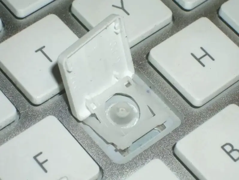 Các bước chi tiết để tháo nút bàn phím laptop Dell
